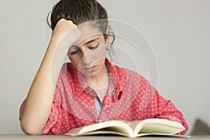 Teen woman reading a book. photo