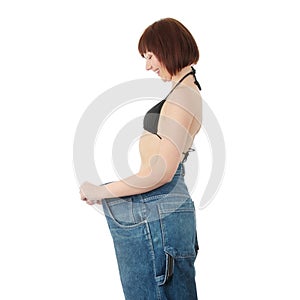 Teen woman showing how much weight she lost