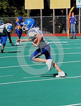 Teen Youth Football Player with Ball