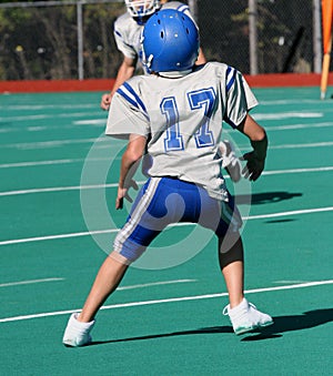 Teen Youth Football Player Ready to Catch