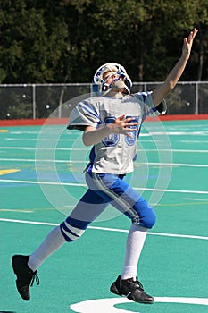 Teen Youth Football Player to Catch the Ball