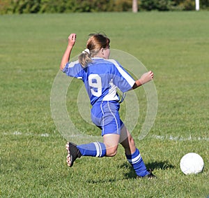 Teen Youth Soccer Kicking Ball