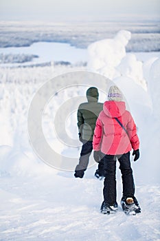 Teenaders hiking in snowshoes