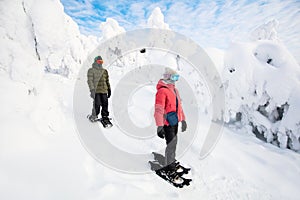 Teenaders hiking in snowshoes