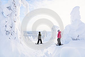 Teenaders hiking in snowshoes