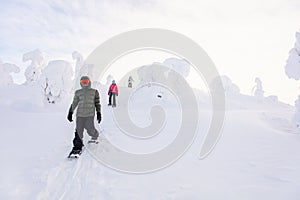 Teenaders hiking in snowshoes