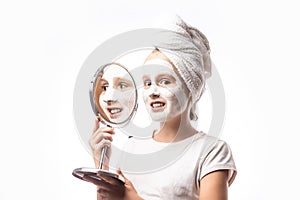 Teenage applying facial cleansing mask, beauty treatments, Teenage and child problems, hygiene, clean and fresh young skin.