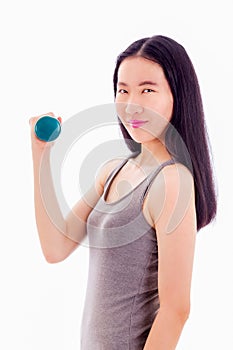 Teenage Asian girl holding dumbbell