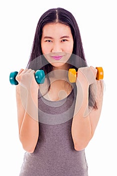 Teenage Asian girl holding dumbbells