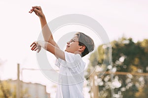 A teenage athlete throws a ball into the basket.