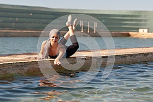 Teenage Ballerina at outdoor shoot at ocean baths - Landscape format