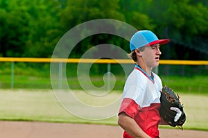 Teenage baseball player during a game.