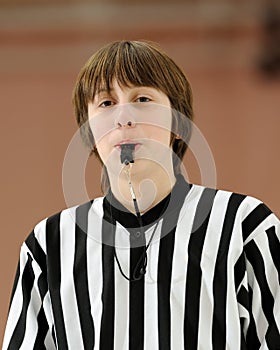 Teenage basketball referee