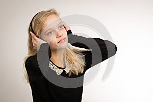 Teenage Blond Girl Listening To Her Headphones