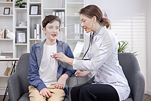 A teenage boy at an appointment with a woman's doctor sits on a chair in an office in a private clinic. A