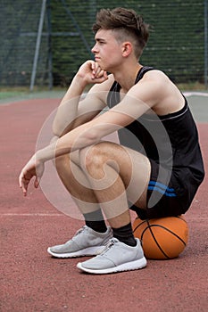 Teenage boy on a basketball court