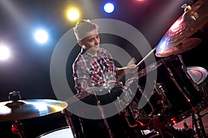 Teenage boy behind drum kit