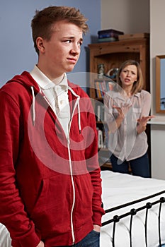 Teenage Boy Being Told Off By Mother