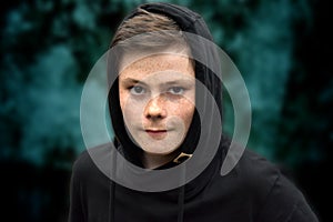 Teenage boy in black hoodie