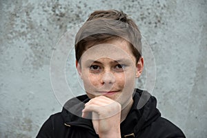 Teenage boy in black hoodie