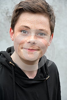 Teenage boy in black hoodie