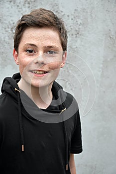 Teenage boy in black hoodie