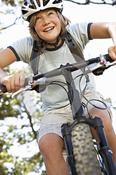 Teenage Boy Cycling Through Countryside