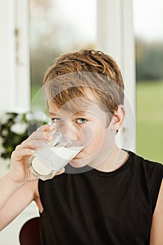 Teenage Boy Drinking Glass of Milk