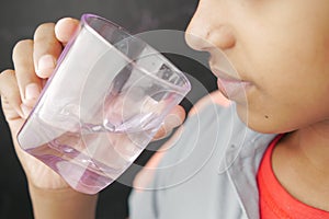 teenage boy drinking water close up