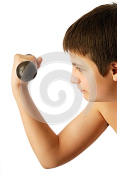 Teenage boy with dumbbell