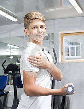 Teenage boy engaged in the gym