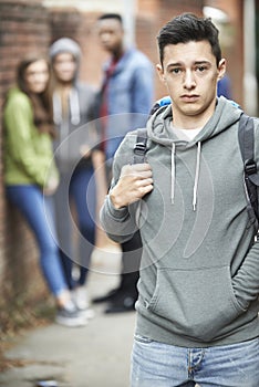 Teenage Boy Feeling Intimidated As He Walks Home photo