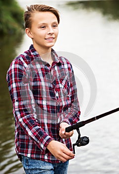 Teenage boy fishing