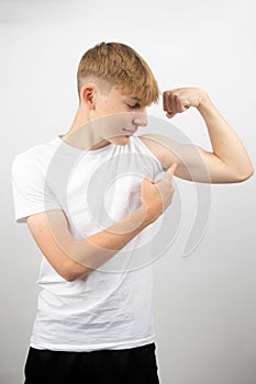 Teenage Boy Flexing His Bicep