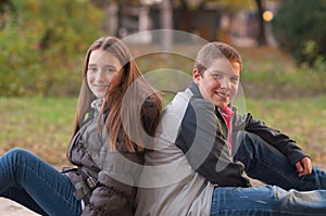 Teenage boy and girl enjoying each others company