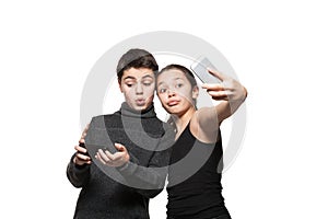 Teenage boy and girl with their smart phone