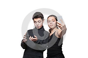 Teenage boy and girl with their smart phone