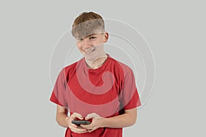 Teenage boy holding a mobile phone