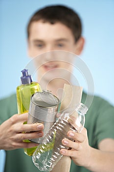 Teenage Boy Holding Recycling