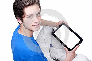 Teenage boy holding a tablet