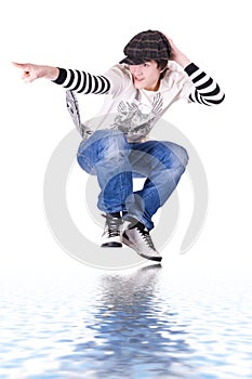 Teenage boy jumping and dancing Locking or Hip-hop photo