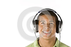 Teenage Boy Listening To Music On Headphones