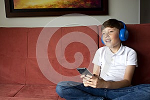 Teenage Boy Listens To Music