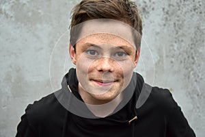 Teenage boy in black hoodie