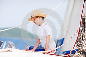 Teenage boy at luxury yacht