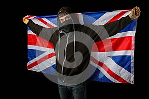 Teenage boy in a mask with a British Flag