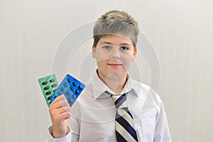 teenage boy with the medicine in his hands