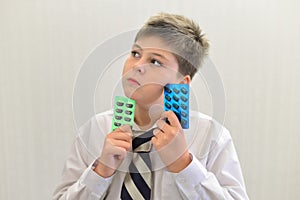 teenage boy with the medicine in his hands