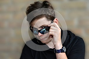 Teenage boy with modern sunglasses