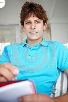 Teenage boy with notebook